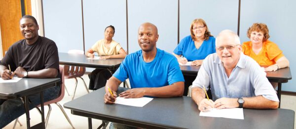 Adults learning in a classroom