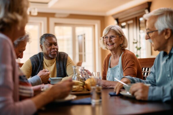 Adults eating lunch together